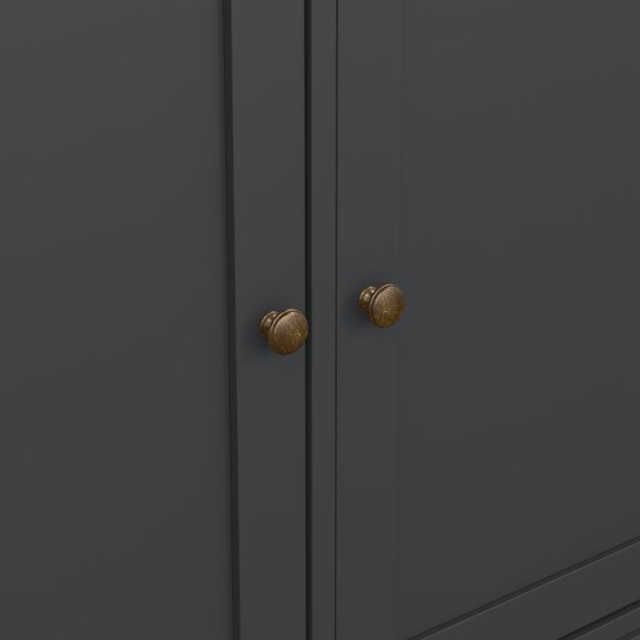 Dark gray cabinet with brass knobs on a plain background
