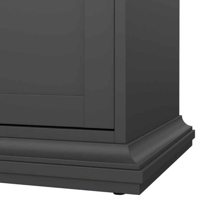 Close-up of a black cabinet corner with a white background