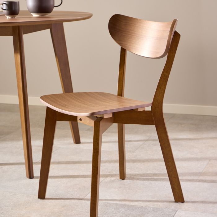Wooden chair and table set on a light wooden floor