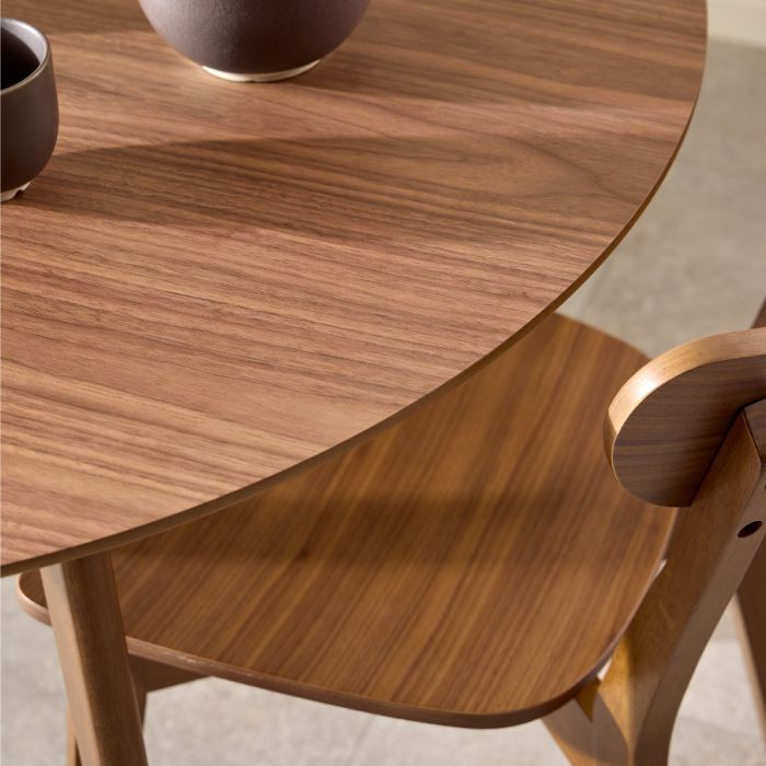 Wooden dining table with a chair, featuring a warm brown finish.