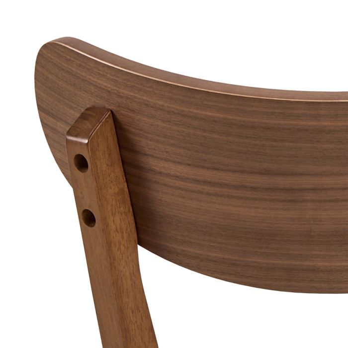 Close-up of a wooden chair backrest on a white background
