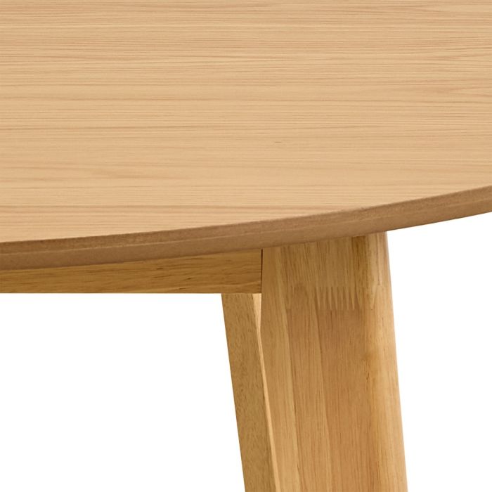 Close-up of a wooden table with a light brown finish on a white background