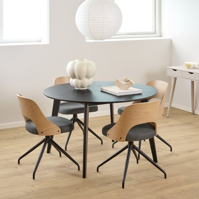 Dining area with round table and chairs in a modern interior setting