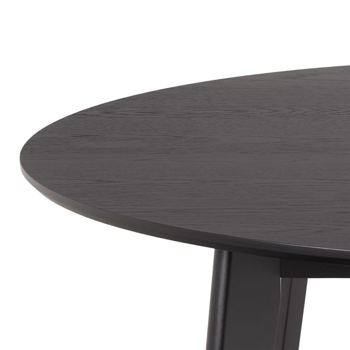 Round dark wooden table on a white background