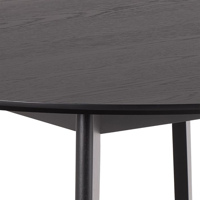 Round black table with a white background