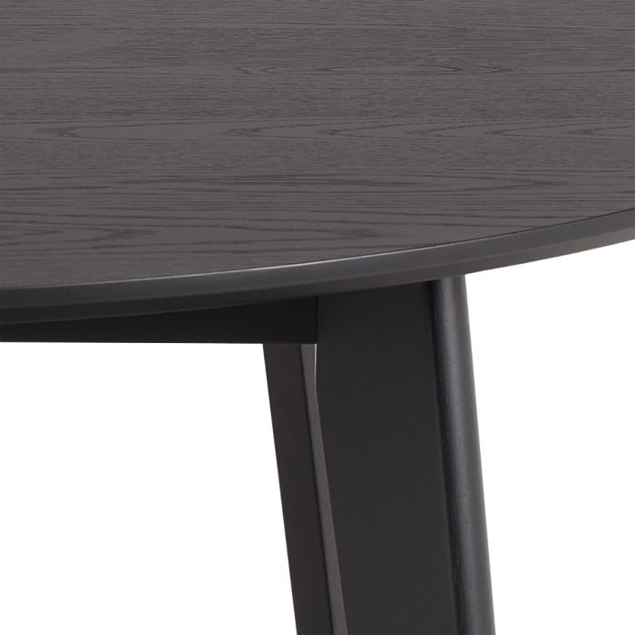 Close-up of a dark gray wooden table with a white background