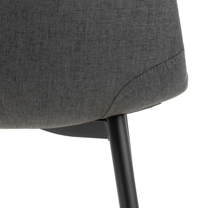 Gray upholstered chair with a black metal leg on a white background