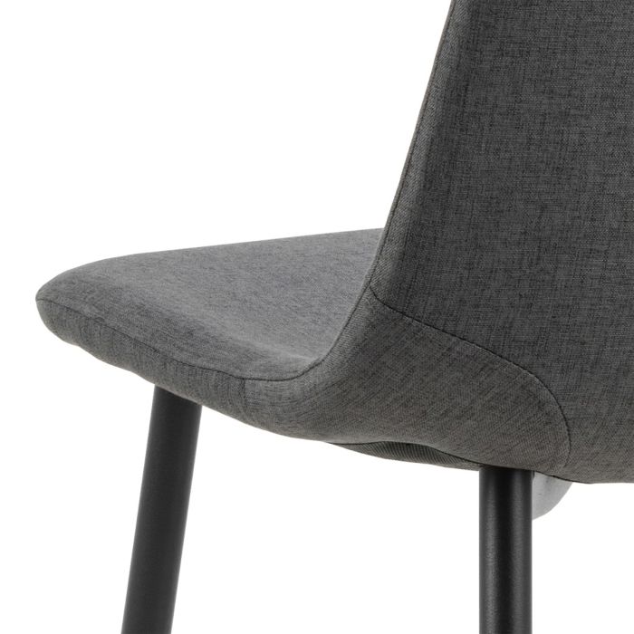 Gray upholstered chair with black legs on a white background
