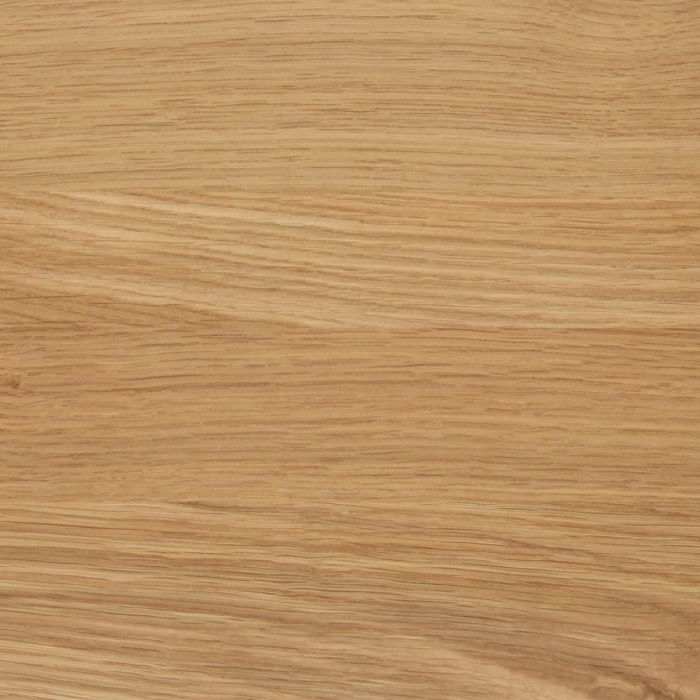 Close-up of a wooden surface with a light brown color and visible grain pattern.