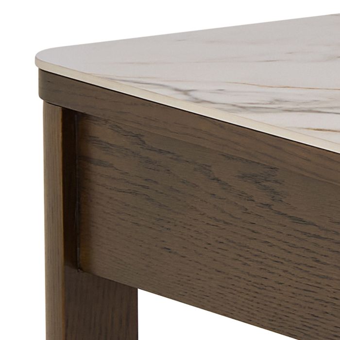 Close-up of a wooden desk with a marble-like top