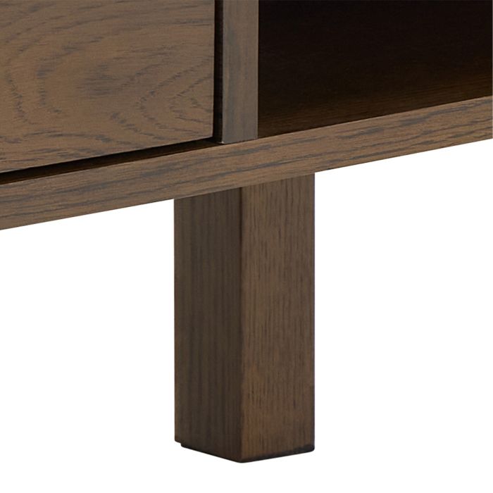 Close-up of a wooden cabinet leg on a white background