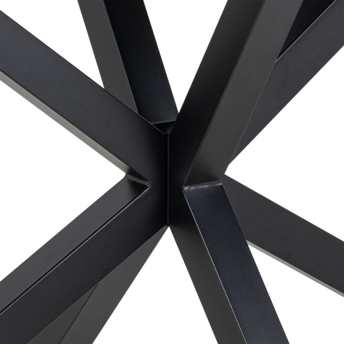Close-up of a black metal frame with intersecting beams on a white background