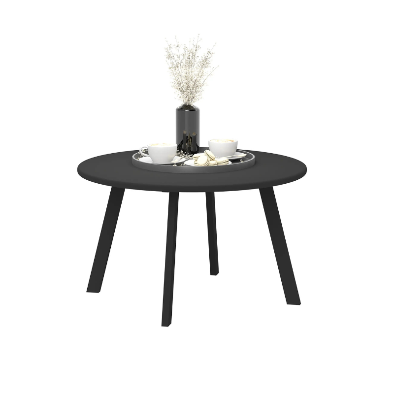 Round black table with decorative items on a white background