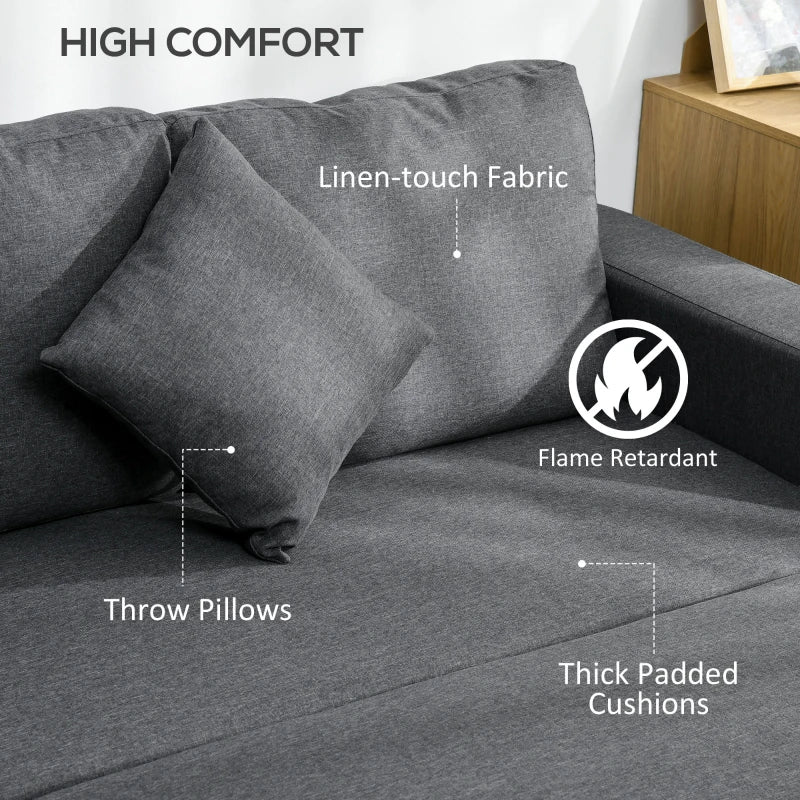 Gray sofa with throw pillows and thick padded cushions, labeled for comfort features.