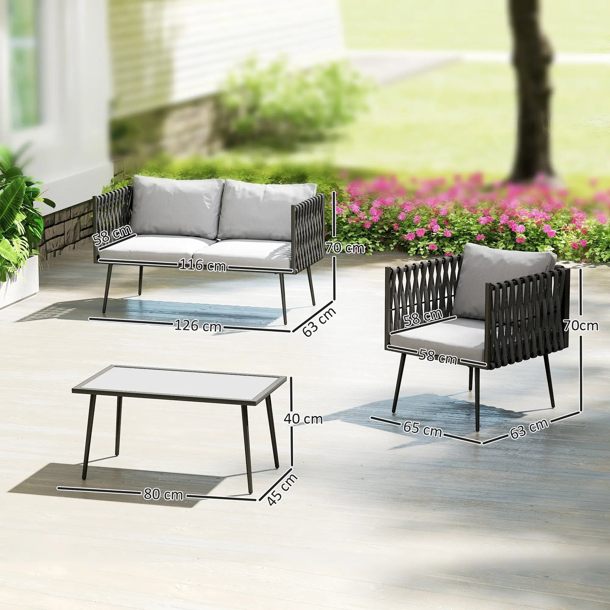 Outdoor furniture set with dimensions displayed on a patio with flowers in the background