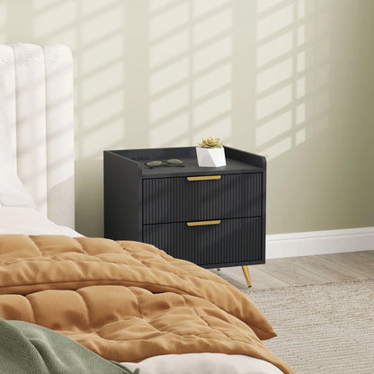Black nightstand with gold handles in a bedroom setting