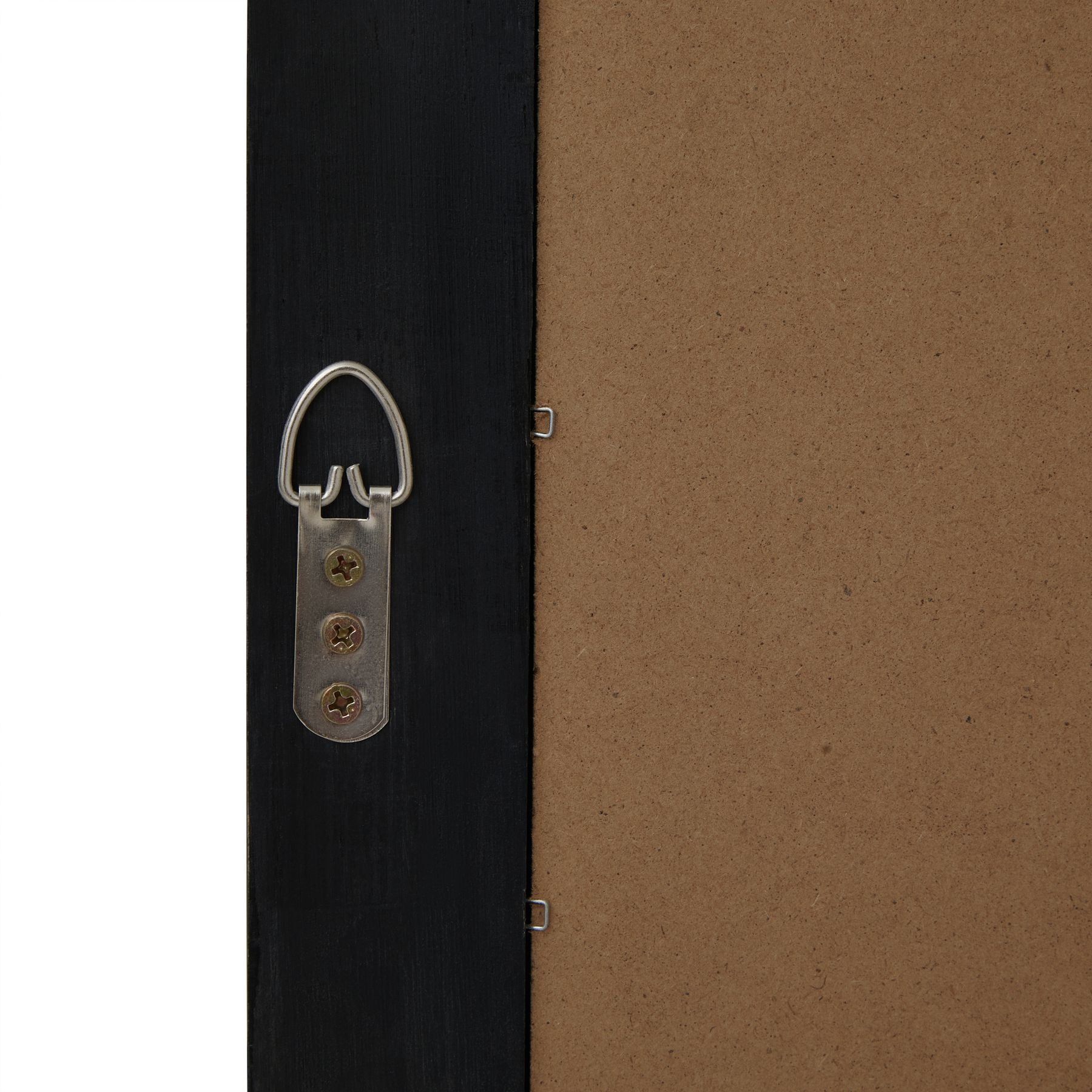 Close-up of a black door with a metal handle and a brown wall.