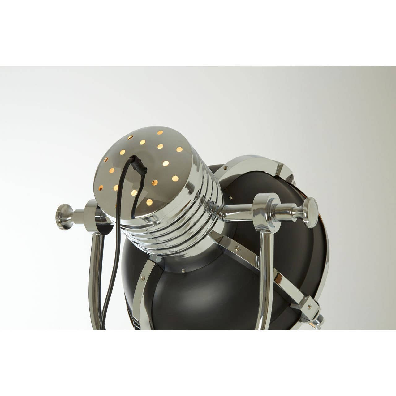 Modern wall lamp with metallic and black design on a white background