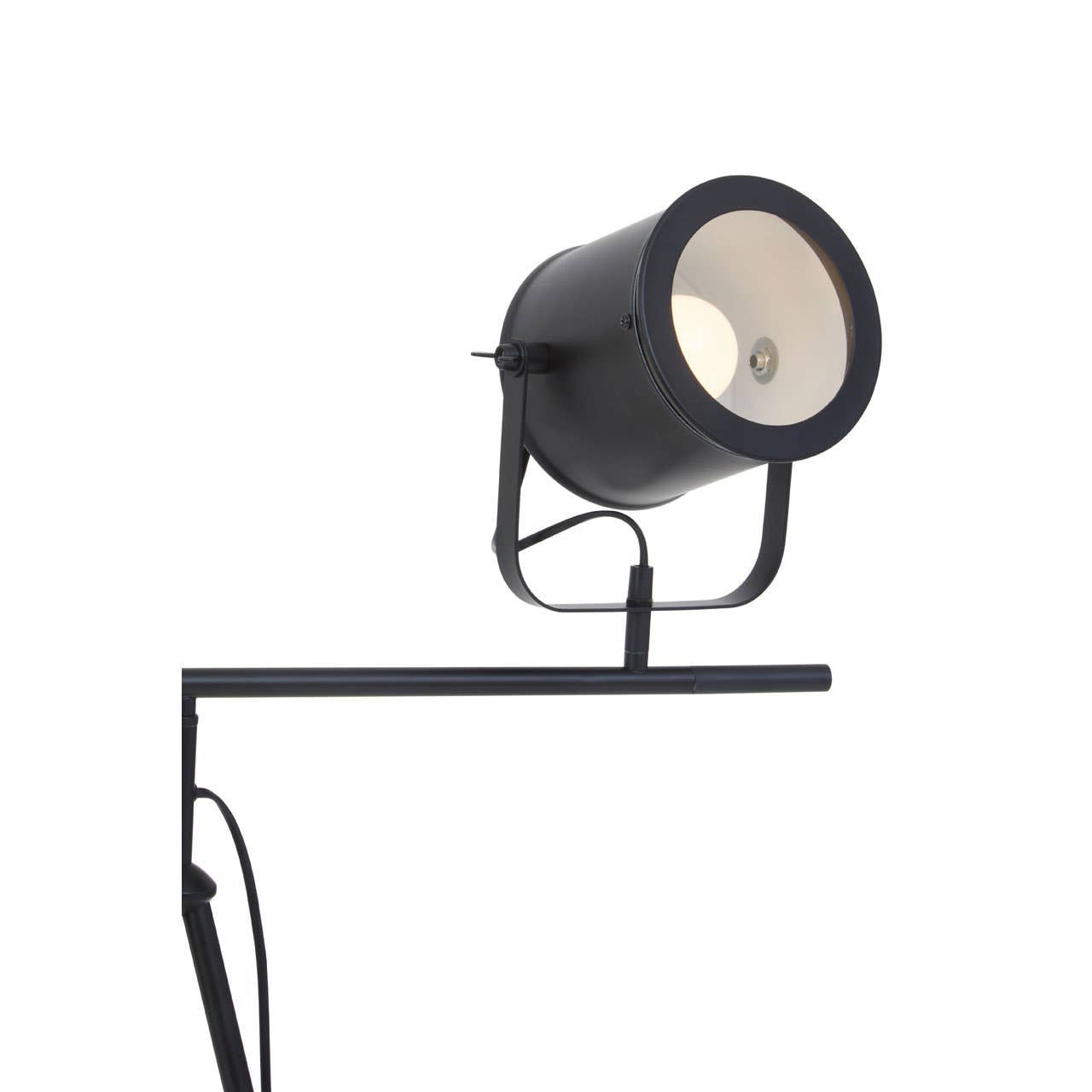 Black floor lamp with a white shade on a white background