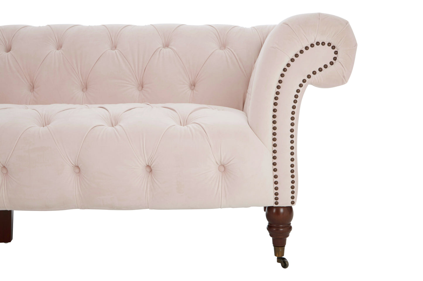 Pink tufted sofa with wooden legs on a white background