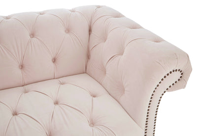 Pink tufted sofa with decorative nailhead trim on a white background