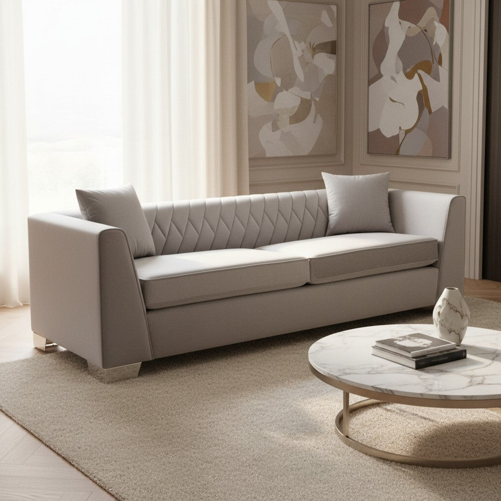 Beige sofa in a living room with abstract art on the wall