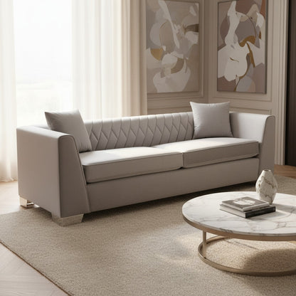 Beige sofa in a living room with abstract art on the wall