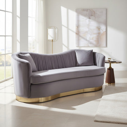 Gray sofa with gold base in a bright living room