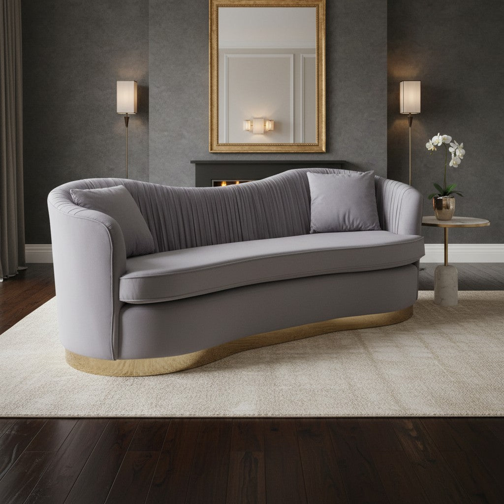 Gray sofa with wooden legs in a stylish room with a mirror and lamps.