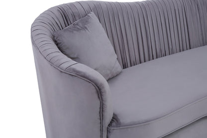 Gray upholstered sofa with a pillow on a white background