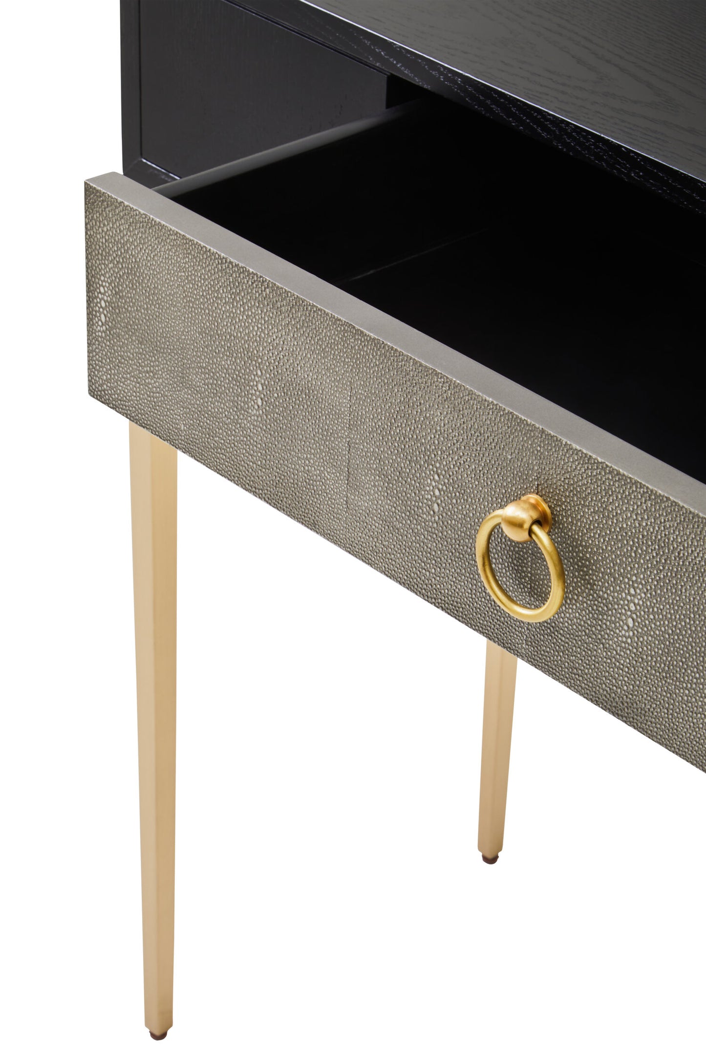 Close-up of a drawer with a gold ring handle on a white background