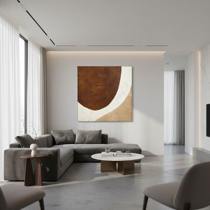 Modern living room with a gray sectional sofa, abstract painting, and minimal decor.
