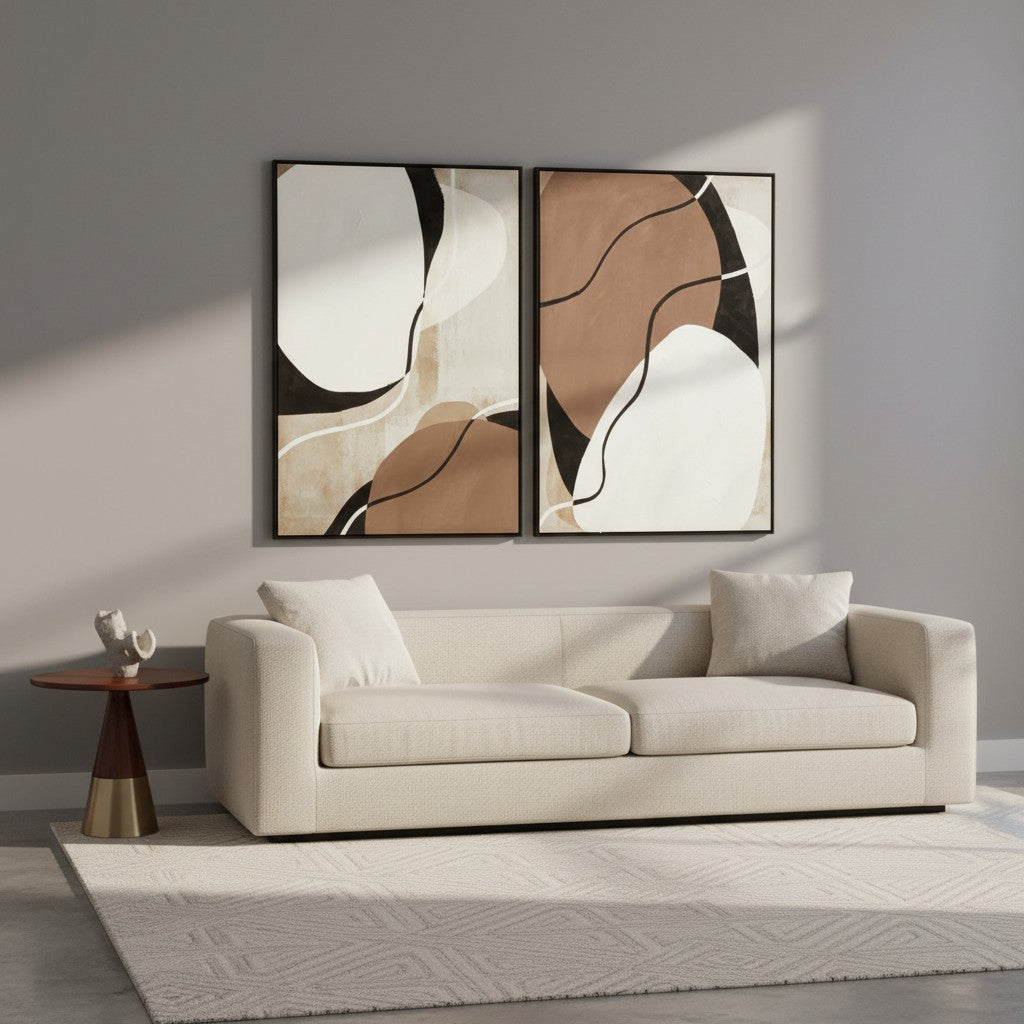 Modern living room with a beige sofa, abstract art on the wall, and a side table.
