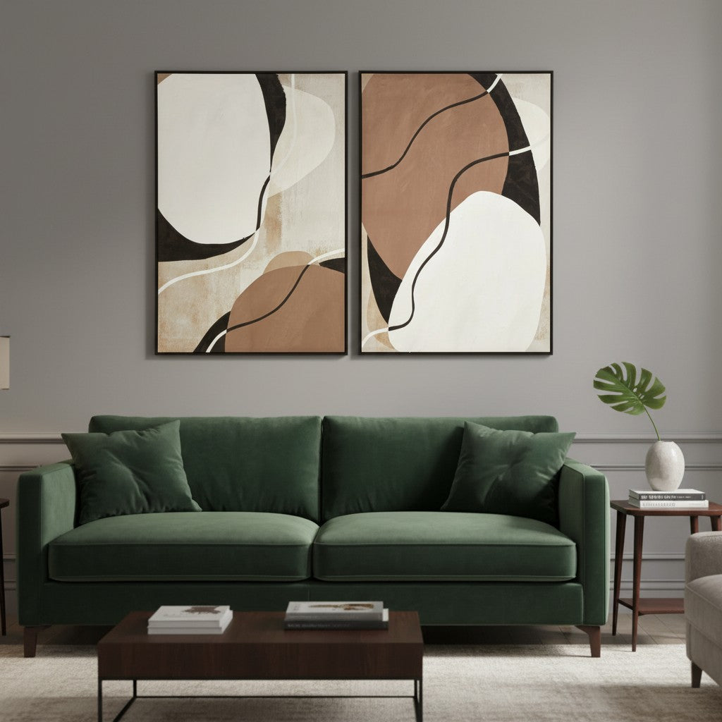 Green sofa in a living room with abstract art on the wall
