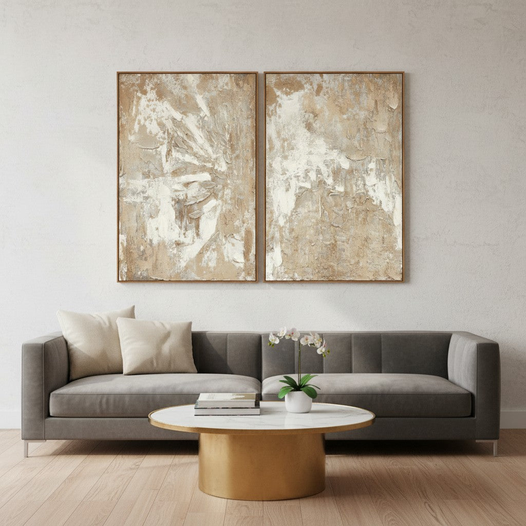 Living room with a gray sofa, round coffee table, and abstract wall art.