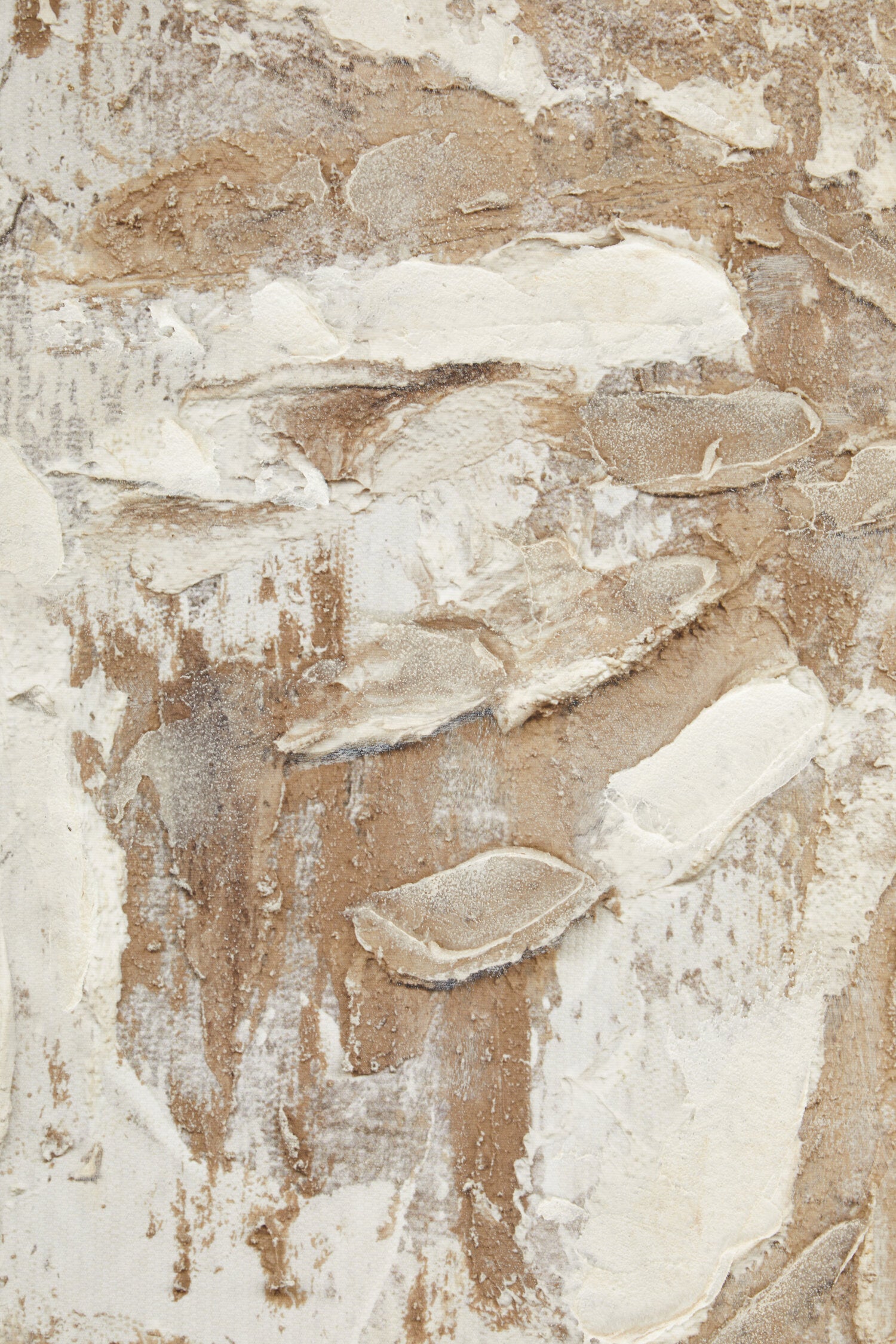 Textured beige and brown surface with abstract patterns