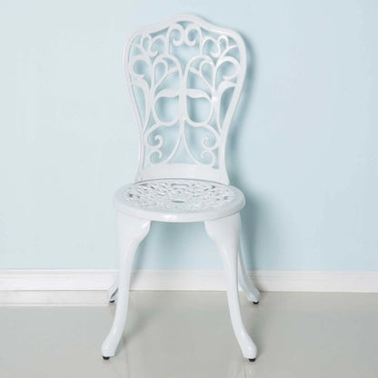 White decorative chair against a light blue wall