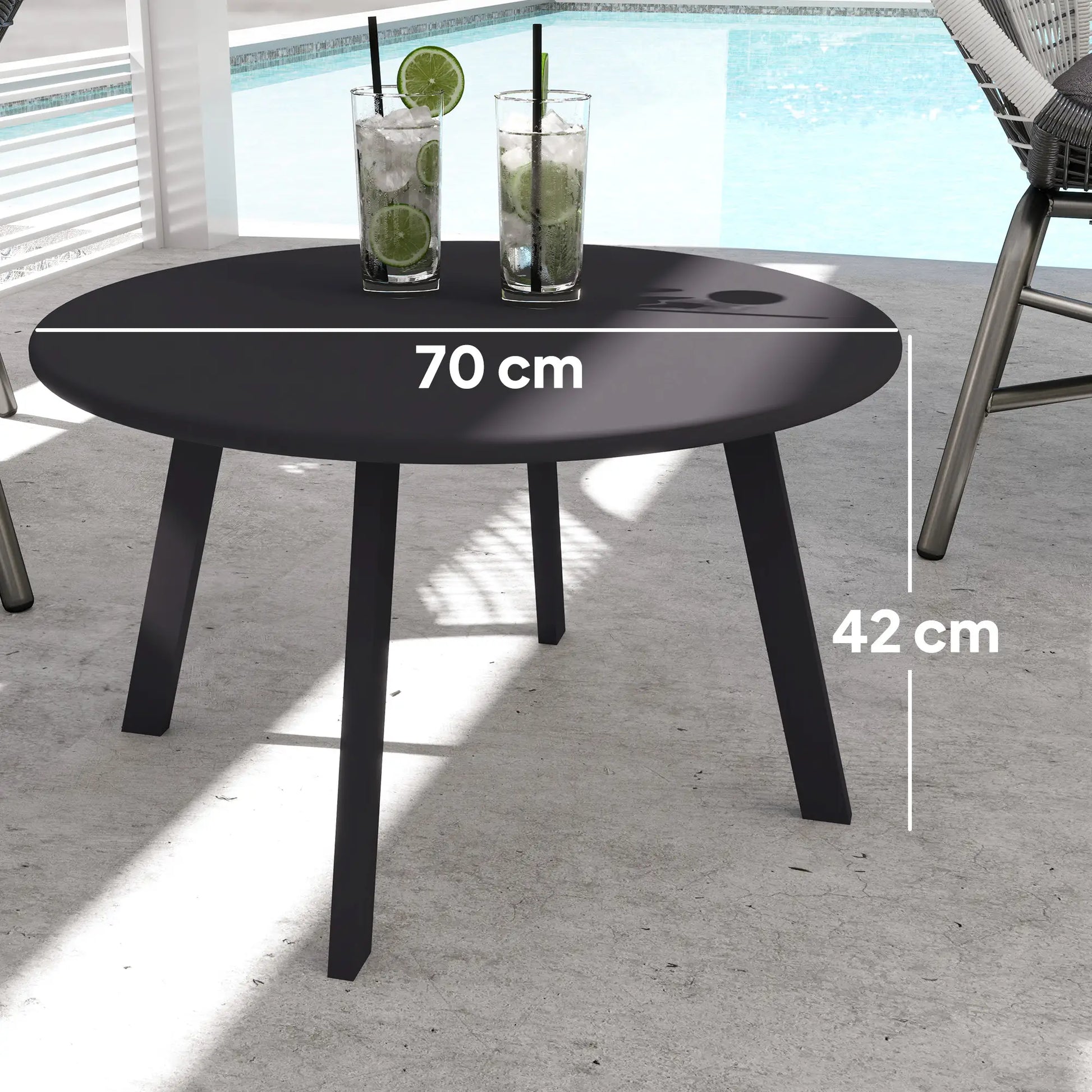 Black outdoor table with dimensions labeled, placed on a concrete surface with a pool in the background.