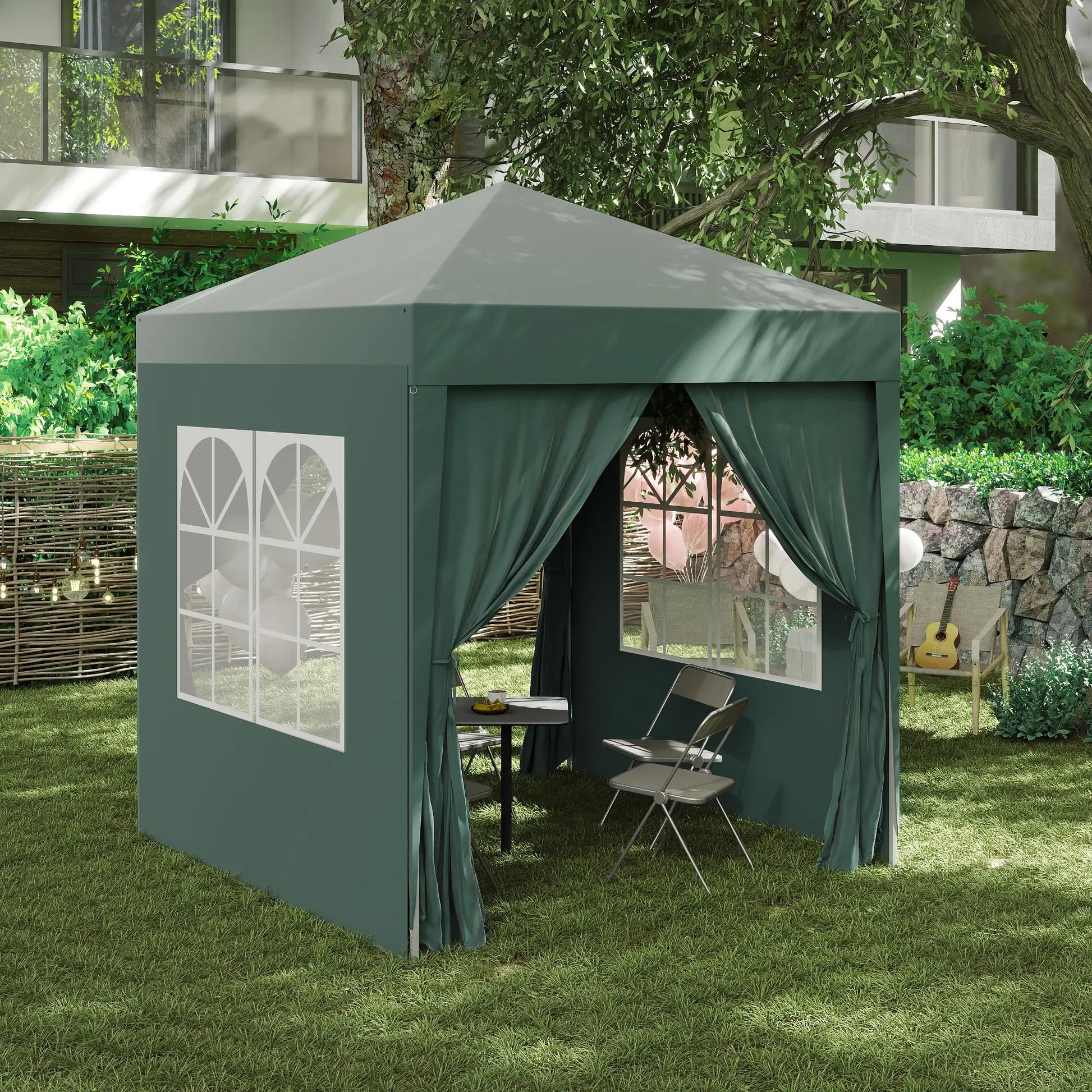 Green outdoor canopy tent with curtains in a garden setting