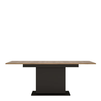 Table with a wooden top and black base on a white background