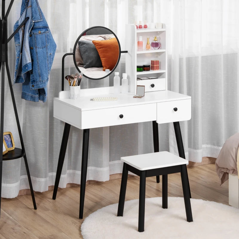 White vanity table with black legs and stool in a room setting.
