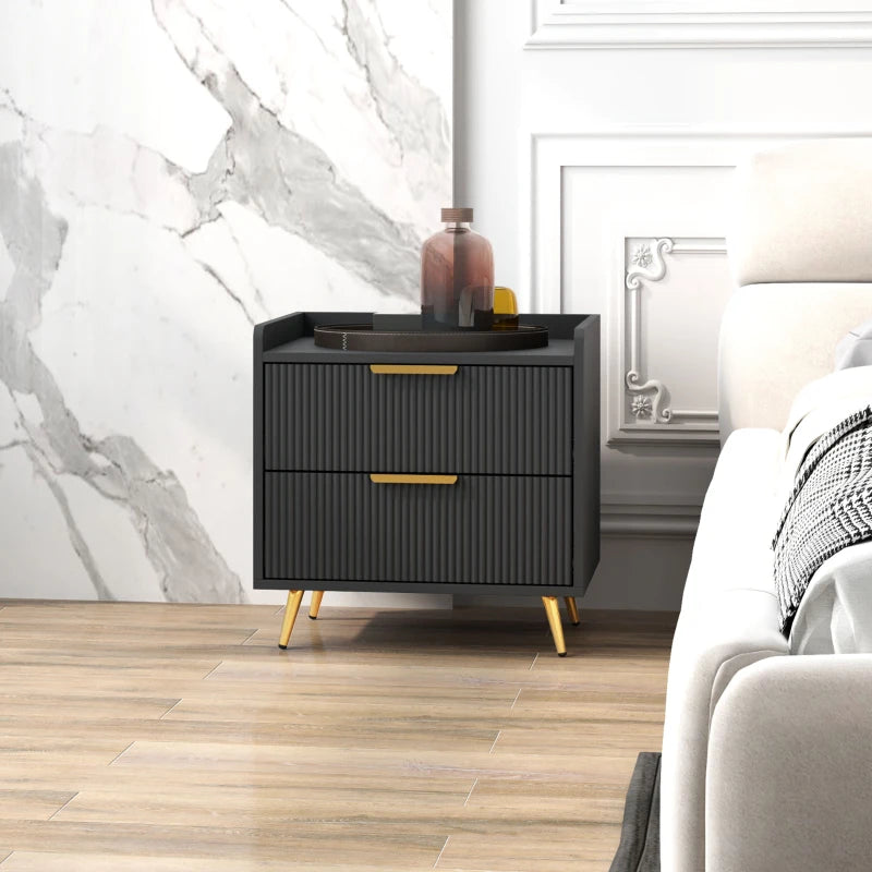 Black nightstand with gold legs in a bedroom setting