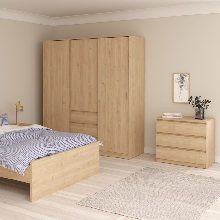 Wooden bedroom furniture set with wardrobe and nightstand in a room.