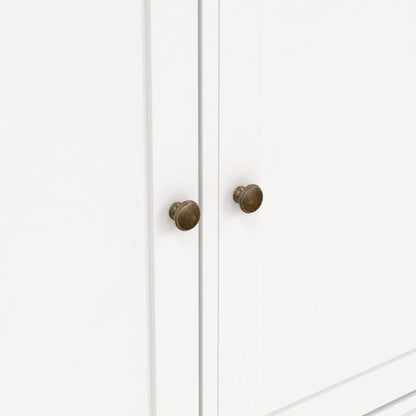 White cabinet with bronze knobs on a white background