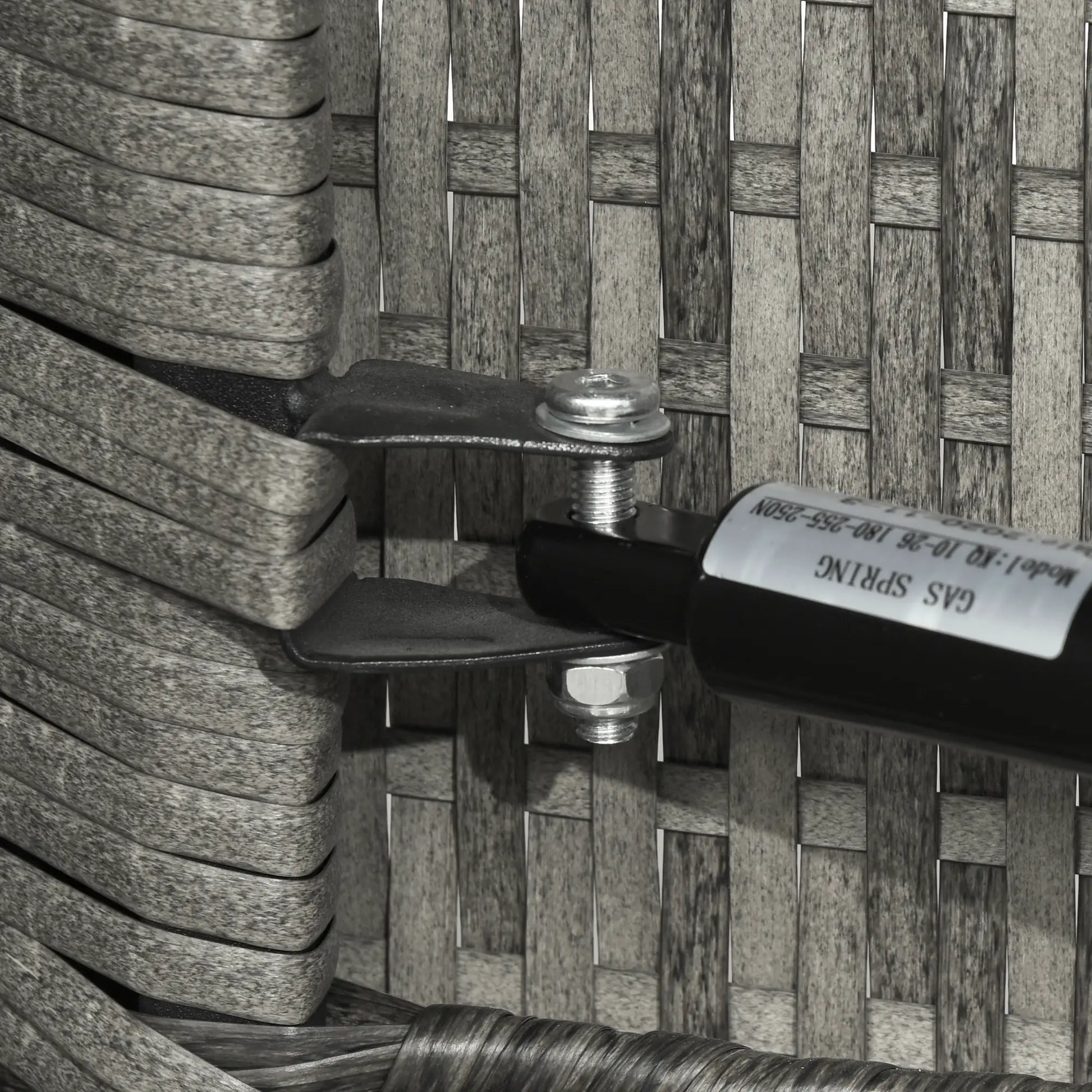 Close-up of a gas lighter attached to a woven surface