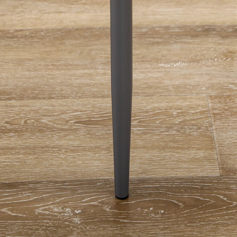 Dark gray cylindrical object on a wooden surface