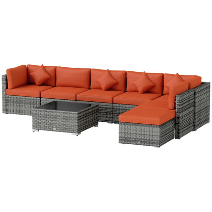 Outdoor furniture set with orange cushions and a gray table on a white background