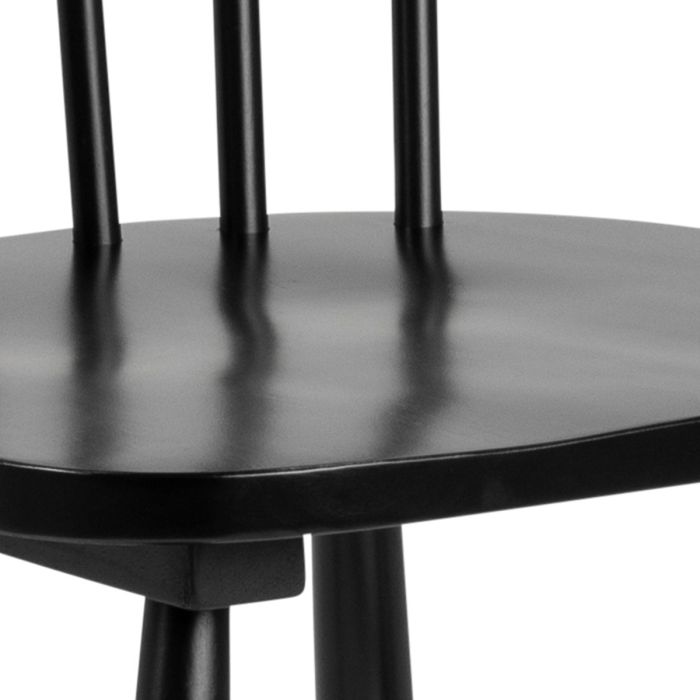 Close-up of a black wooden chair with a white background