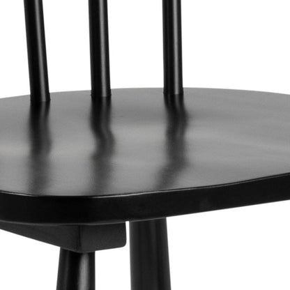 Close-up of a black wooden chair with a white background