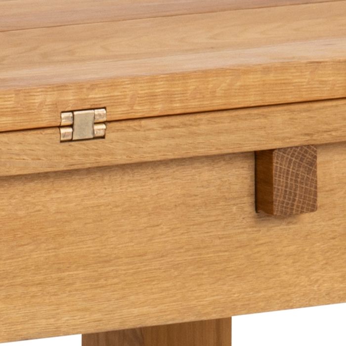 Close-up of a wooden drawer with a latch on a white background